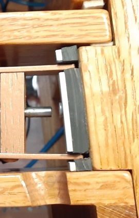 Groove cut in frame strut for belt drive
